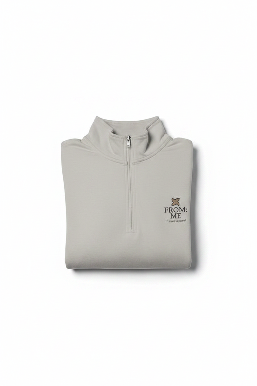 Folded beige pullover with 'From Me' logo on a white background