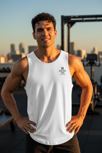 Man wearing a white tank top with a logo and text, standing on a rooftop with city skyline in the background | From Me Fitness Apparel