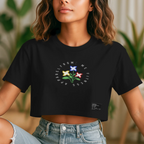 Person wearing a black t-shirt with a colorful flower design and text.