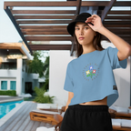 Woman wearing a blue t-shirt with a floral design by a poolside | From Me Fitness Apparel
