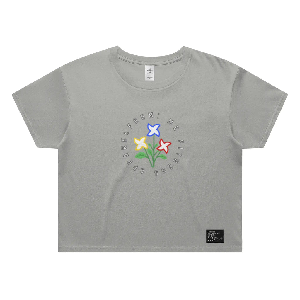 Gray t-shirt with colorful flower graphic and text on a white background