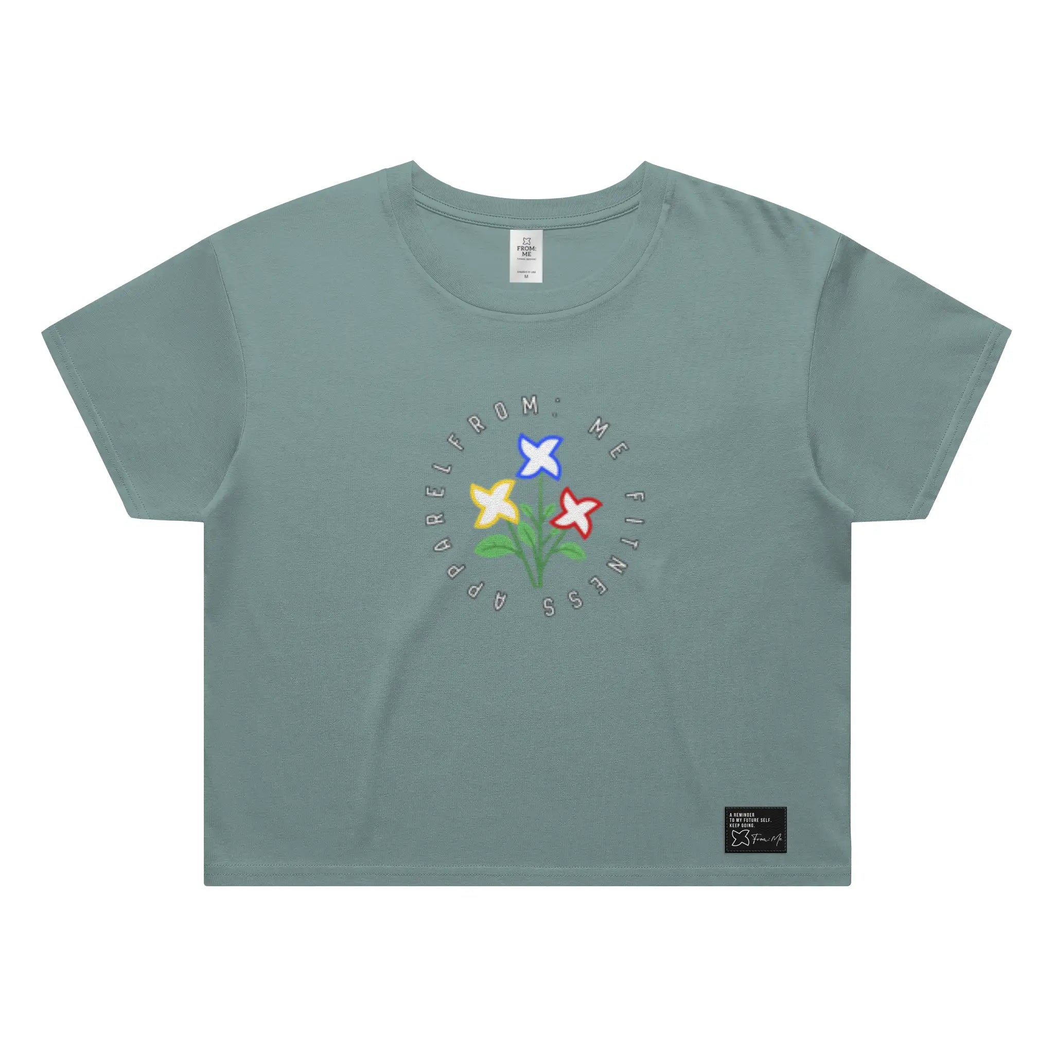 Green t-shirt with colorful floral design and text on a white background