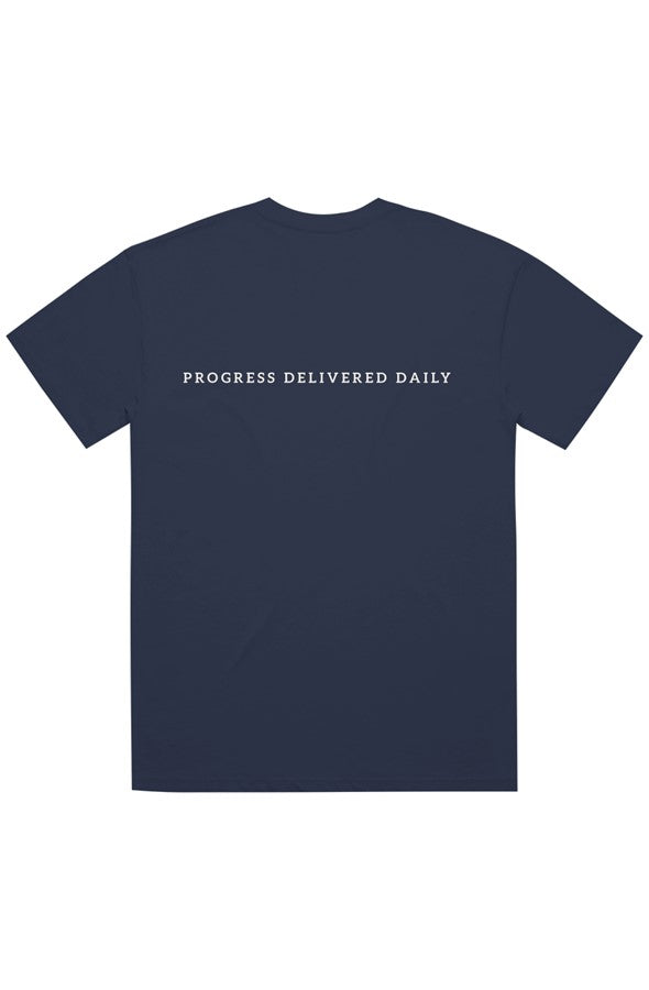 A navy blue short-sleeve t-shirt with the phrase 'PROGRESS DELIVERED DAILY' printed in white across the chest, displayed on a solid white background.